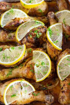 chicken with lemons and herbs on the side, ready to be cooked in the oven