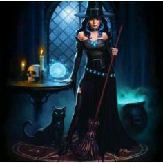 a woman dressed as a witch holding a broom and standing in front of a cat