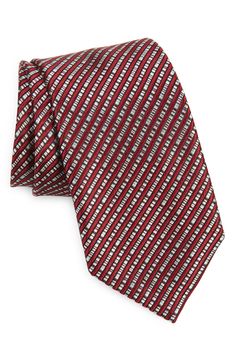 Angled stripes woven in subtly mixed colors distinguish a tie crafted from polished silk jacquard and styled to elevate any formal look. 100% silk Dry clean Made in Italy Elegant Striped Ties For Work, Elegant Formal Suit And Tie Accessories With Vertical Stripes, Elegant Striped Suit Accessories For Workwear, Elegant Striped Ties For Office, Elegant Business Ties With Vertical Stripes, Red Elegant Suit And Tie Accessories For Workwear, Elegant Standard Tie With Vertical Stripes, Elegant Red Silk Tie, Red Silk Ties For Business