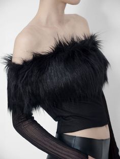 In Black, made of Deadstock Faux Mink Fur and recycled Sheer Jersey in 2 textures. Off-the-shoulder Style.Our collections are made using 100% Vintage Materials, Deadstock and Scraps. Being recycled, material details may vary for each individual item. Every piece is uniquely handmade with care in our Atelier in Milan, Italy.Care: Dry clean only.The model is 178 cm / 5′ 8″ and wears the size XS-S.XS-S Length: 37 cm / 14,5" ; Shoulders circumference: 45 cm / 17,7" ; Sleeve (off-shoulder): 56 cm / 22"M-L Length: 40 cm / 15,7"; Shoulders circumference: 48 cm / 18,8"; Sleeve (off-shoulder): 58 cm / 22,8" Top With Long Sleeves, Evening Tops, Milan Italy, Mink Fur, Off The Shoulder, Faux Fur, Off Shoulder, Dry Clean, How To Wear