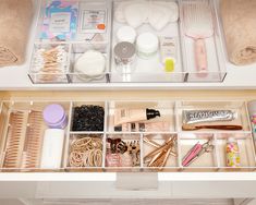 the drawers are organized with various items such as hairbrushes and other beauty products