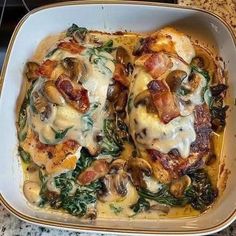 a casserole dish with chicken, spinach and cheese