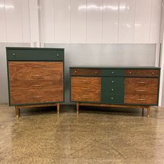 two green and brown dressers sitting next to each other on top of a floor