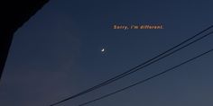 an image of the moon and venus taken from behind power lines at night, with text that reads sorry, i'm different