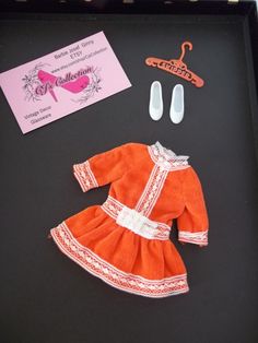 This is Skipper's original Sweet Orange ensemble introduced in 1971. Made by Mattel. # 3465.  This is a darling velvet long sleeve dress with lace as accent. Also included is a vintage Skipper hanger and a pair of white shoes. This ensemble is darling and worthy of adding to your collection. This will be a wonderful addition to any collection. So stylish and chic. Would look great on a variety of Skippers or Skooters! Thank you for visiting my Etsy shop CjsCollection. I hope you enjoyed the sele Retro Long Sleeve Costume Dress, Spring Costume Vintage Dress With Long Sleeves, Spring Vintage Long Sleeve Costume Dress, Spring Vintage Long Sleeve Dress For Costume, Spring Long Sleeve Vintage Dress Costume, Vintage Spring Costume Dresses, Retro Long Sleeve Vintage Costume Dress, Retro Long Sleeve Vintage Dress For Costume, Vintage Dresses For Costume Spring Festival