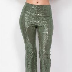 These Sequined Pants Add A Touch Of Glam To Your Formal Wear. The Mid-Rise Elastic Waistband And Flared Leg Create A Comfortable And Flattering Fit, While The Full Length Adds A Touch Of Sophistication. Key Features: - Fabric: 88% Polyester, 6% Metallic, 6% Spandex For A Comfortable Stretch And Glamorous Finish. - Fit: Mid-Rise With An Elastic Waistband And Flared Leg For A Flattering Silhouette. - Color Options: Available In Olive. - Sizes: Available In S, M, L. - Design: Features Dazzling Sequ Green Sequined Party Bottoms, Glamorous Green Sequined Bottoms, Green Stretch Sequined Bottoms, Green Sequined Stretch Bottoms, Green Sequined Bottoms For Night Out, Glamorous Green Bottoms For Party Season, Green Stretch Pants For Party, Green Bottoms For Night Out Party, Green Fitted Pants For Party