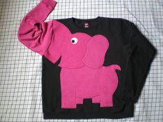 *UPcycled from NEW sweatshirts, crew neck sweatshirt in a  cotton/polyester blend with elephant applique and trunk sleeve. All my appliques are designed by me, hand cut, and sewn by me, NOT just stuck on, so there will be no fear that your ear may fall off later.  This one is available in Unisex S  M L and XL **PLEASE REMEMBER TO PUT YOUR SIZE IN THE MESSAGE TO SELLER~THANKS Elephant Sweater, Elephant Sweatshirt, True To Myself, Black Elephant, Elephant Applique, Elephant Shirt, Elephant Trunk, Outfits Jewelry, Head Shoulders