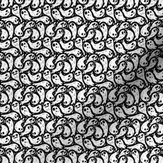 black and white image of many faces in the shape of an abstract pattern on a sheet of paper