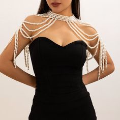 The Woven Pearl Body Chain Knitted Shoulder Wrap is a stunning accessory that combines the elegance of pearls with the intricate design of a knitted shoulder wrap. This piece features delicately woven pearls that form a body chain, gracefully draping across the shoulders and upper body. The knitted design adds a unique texture, creating a beautiful contrast between the softness of the pearls and the intricate weaving. Perfect for making a bold fashion statement, this body chain and shoulder wrap combo is ideal for special occasions or to elevate any outfit with a touch of luxury and sophistication. Bead Body Chain, White And Gold Jewelry, Pearl Clothes, Skirt Jewelry, Pearl Body Chain, Cloth Accessories, Shoulder Necklace, Elegant Shawl, Eyebrow Ring