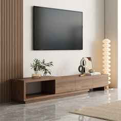 a flat screen tv mounted on the wall above a wooden entertainment unit in a living room