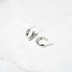 Beautiful chunky style small hoop earrings. They are bold yet still minimalist and compliment many different styles and looks! They are super on trend! Made of 925 Sterling Silver THICK plating of 14k Gold or Rhodium Nickel-Free & Hypoallergenic Inner Diameter: 16mm Thickness: 5mm Sold as a pair Earrings On Model: Studs, Huggies Minimalist Shiny Finish Hoop Earrings For Everyday, Modern Shiny Huggie Earrings As Gift, Modern Huggie Earrings With Shiny Finish As Gift, Minimalist Shiny Hoop Earrings For Everyday, Modern Chunky Small Hoop Earrings, Minimalist Huggie Hoop Earrings With Shiny Finish, Everyday Minimalist Hoop Earrings With Shiny Finish, Everyday Chunky Hoop Earrings, Modern Polished Hoop Earrings For Everyday