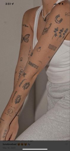 a woman with many tattoos on her arm