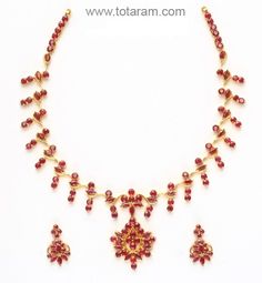 Rubies Necklace & Long Earrings Set in 22 Karat Gold.
  Gross Gold Weight of Necklace Set: 37.000 grams
  Total Weight of Rubies: 17.50 Carats
  
    Note: We can make this same design with Emeralds, Blue Sapphire 
  or in any other colored stone of your choice for the same price. - 235-SET277 - in 37.000 Grams for USD $3221.99. 
Made in India by Totaram Jewelers Online this product is in Gold - 22 Karat BIS Hallmark 916 KDM Gold  & is an excellent gift for Adult - Women. Ships fully Yellow Gold Ruby Temple Necklace For Celebration, Yellow Gold Ruby Kundan Necklace In Temple Jewelry Style, Yellow Gold Kundan Necklace With Ruby In Temple Style, Red 22k Gold Temple Necklace For Celebration, Formal Ruby Temple Necklace, Yellow Gold Ruby Kundan Necklace For Celebrations, Yellow Gold Kundan Necklace With Ruby For Celebration, Ruby Temple Necklace In Yellow Gold Gift, Yellow Gold Ruby Temple Necklace Gift