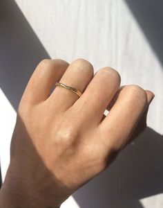 Custom sized in approx. 2-3 weeks. Please contact us about rush orders. A natural, uneven band inspired by organic forms and crafted in Gold. Specifications: 14k yellow gold. Band varies from 2 - 2.5mm width. (Also available in white gold & platinum, see also our Tall molten band) For engraving, you can leave a note with your request when checking out, 25 characters max. Adjustable 14k Gold Bands For Everyday, 14k Gold Open Band For Everyday, Tiny Classic Round Band Jewelry, Dainty Hand Forged Rings For Everyday, Minimalist Wide Band With Polished Finish, Everyday 14k Gold Bands With Simple Design, Tiny Classic Yellow Gold Jewelry, Everyday Simple 14k Gold Bands, Minimalist Yellow Gold Thick Band Wedding Ring