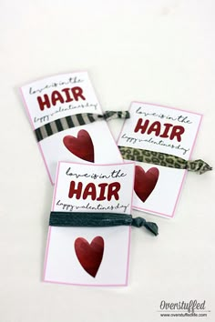 three valentine's day gift tags with hair written on them