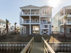 the house is on the water and has two balconies that are attached to each other