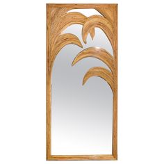 a wooden door with a mirror on the front and side panels that have leaves carved into them