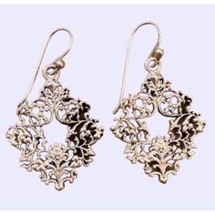 Barse Bridgeton Silver earrings are handcrafted in Thailand, showcasing a unique design. They offer a chic, timeless addition to any outfit, enhancing your style with a touch of elegance. Delicate small * Handcrafted in Thailand * Unique Bridgeton style * Made from genuine Silver * Timeless and versatile  * Ornate Wreath Style * Intricate and Delicate Size: Womens Over 1 inch Condition: Pre-Owned Good Elegant Nickel-free Sterling Silver Hoop Earrings, Elegant Nickel-free Dangle Hoop Earrings, Ornate Handmade Chandelier Earrings For Party, Handmade Ornate Chandelier Earrings For Parties, Classic Filigree Chandelier Earrings As Gift, Classic Filigree Chandelier Earrings For Gift, Handmade Vintage Sterling Silver Chandelier Earrings, Handmade Teardrop Hoop Earrings For Formal Occasions, Elegant Pierced Hoop Earrings As Gift