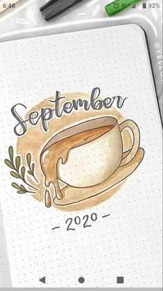 an open notebook with a cup of coffee on it and the words september written in cursive writing