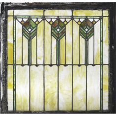 an old stained glass window with geometric designs