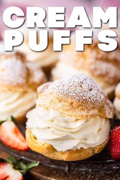 cream puffs on a plate with strawberries and powdered sugar in the background