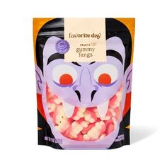 a bag of gummy rings with an evil mask on it's face and tongue