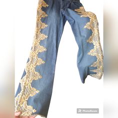 These Nwt Jeans With Gold Lace Embroidery Down Each Leg Are Gorgeous! Size 8 Mixt Brand Strech Pants. Boho Hippy Vibes Embroidered Denim Wide-leg Bottoms, Embroidered Wide Leg Denim Bottoms, Embroidered Wide-leg Denim Bottoms, Blue Embroidered Wide Leg Jeans, High Waist Embroidered Blue Pants, Blue Embroidered High Waist Pants, Embroidered Denim Blue Pants, Embroidered Wide Leg Denim Blue Jeans, Embroidered Wide Leg Denim Blue Pants