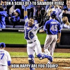 an image of a baseball player that is jumping in the air with his hands up