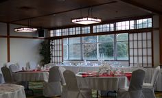 a banquet room set up with tables and chairs