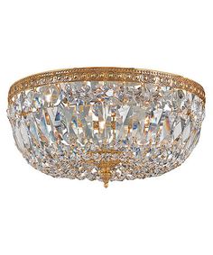 a large crystal flush light fixture with gold trim