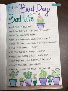 an open notebook with the words bad day not a bad life written on it