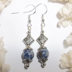 This Lovely Beaded Earring Set Was Handmade By Me With Blue And Grey Stone Sodalite Style Gem Stone Beads With Some Brown/Black In Them. They Have Antiqued Silver Toned Costume Jewelry Beads. The Pair Dangle & Drop From 925 Sterling Silver French Fish Hook Ear Wires For Women's Pierced Ears. 2 Inches Tall & 3/8 Inch Wide. Each Single Earring Weighs 2.7 Grams. The Perfect-Colored Fashion Accessory To Wear With Faded Or Dark Blue Jeans. Get Them As A Sweet Treat For Yourself Or As A Thoughtful Gif Silver Sodalite Jewelry With Natural Stones, Silver Jewelry With Natural Sodalite Stones, Silver Lapis Lazuli Dangle Earrings, Silver Lapis Lazuli Drop Earrings, Silver Lapis Lazuli Pierced Earrings, Silver Lapis Lazuli Gemstone Earrings, Nickel Free Silver Lapis Lazuli Jewelry, Blue Sodalite, Single Earring