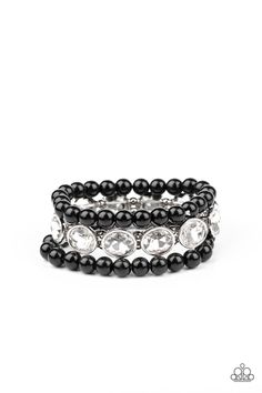 Infused with a pair of stretchy black beaded bracelets, a strand of oversized oval white gems are threaded along stretchy bands around the wrist for a flawlessly fabulous finish. Sold as one set of three bracelets. 1/27/2021 Paparazzi Accessories Jewelry, Black Beaded Bracelets, Black Gems, Gems Bracelet, White Bracelets, Rhinestone Ring, Black Bracelets, Jewelry Images, Paparazzi Accessories