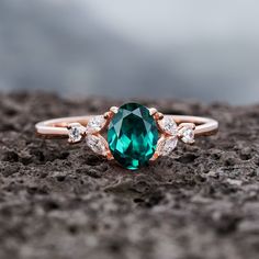 Through time, the emerald has been known as a symbol of truth and love.  ITEM DESCRIPTION This ring is special for occasion as a gift for girlfriend and wife as anniversary gift, birthday gift, Mother's Day Gift, souvenir present. *Center Stone:  0.8 Carats, 7X5mm Oval Cut Lab Emerald  *Accent Stone:  0.2 Carat  Moissanite or CZ(silver only) *Shank width: approx. 1.5mm(bottom) *Prong Setting The stones of the ring can be replace with other different kinds of gemstone such as aquamarine, amethyst Oval Emerald Ring, Fire Opal Engagement Ring, Vintage Emerald Engagement Ring, Art Deco Rose, Birthstone Engagement Rings, Opal Engagement Ring Set, Smaragd Ring, Emerald Ring Vintage, May Birthstone Rings