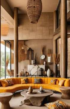 a living room filled with lots of yellow furniture