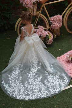 PERFECT FLOWER GIRL DRESS✨ Beautiful Baby Flower girl dress with shiny lace embroidery and amazing puffy skirt! Process time: 1-2 working days Delivery time: 2-4 working days  Also offer express overnight delivery https://www.etsy.com/listing/1298332912/express-delivery?click_key=eb8207bd8376c2fa762384c4d5701f79c6bcbc77%3A1298332912&click_sum=63123b47&ga_search_query=express&ref=shop_items_search_1&frs=1 *Train is detachable & all dresses have bow* Age 1.5 Height 86cm/34in Chest 51cm/20in Waist Claire Pettibone Bridal, Toddler Flower Girl Dress, Toddler Flower Girl, Ivory Girls Dress, Ivory Flower Girl Dress, Flower Gown, Lace Flower Girl Dress, Girls Ball Gown, Puffy Skirt