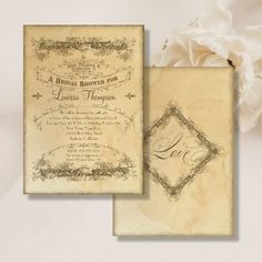 an old - fashioned wedding card and envelope are displayed on a white background with flowers