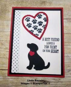 a card with a black dog and red heart on it's side that says, a best friend leaves a paw print on your heart