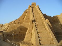 an ancient pyramid made out of sand in the desert