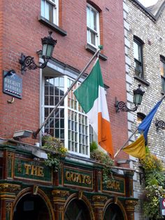 an irish flag hanging from the side of a building