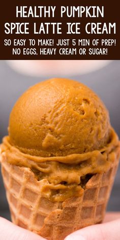 a hand holding an ice cream cone with the words healthy pumpkin spice latte ice cream