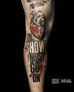 a man's leg with tattoos on it and the words, my heart is slowly i must go on