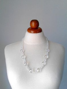 More beaded necklaces : https://www.etsy.com/shop/PlexisArt?ref=seller-platform-mcnav§ion_id=22155194 Wonderful vintage style necklace suitable for any occasion. Multifaceted crystal clear glass beads in two sizes, 20mm and 10mm. Finished with a silver tone clasp withe strass. A super example of a vintage necklace in original authentic condition. All of my necklaces is handmade with love and full attention to detail. The materials I use, are made from a small local traditional company. They use Clear Crystal Necklaces With Faceted Beads, White Faceted Crystal Necklaces, White Faceted Crystal Necklace, Clear Crystal Beaded Necklaces With Faceted Beads, Ombre Necklace, Clear Necklace, Clear Crystal Necklace, Vintage Style Necklace, Bold Necklace