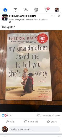 a book on a wooden table with an image of a woman and dog in the background