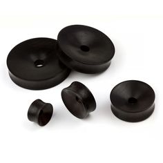 three black plastic knobs and one is empty