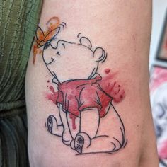 a cartoon bear with a butterfly on it's arm