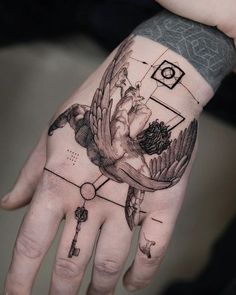 a person's hand with a tattoo on it and a bird flying over the top