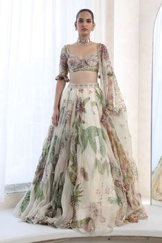 Ivory lehenga with floral print in a flowy silhouette, embellished by sequins. Comes with matching blouse and dupatta. - Aza Fashions Flowy Lehenga Designs, Aza Fashion Lehenga, Beach Wedding Indian Outfit, Boho Fashion Indian, Couple Designer Outfits, Printed Lehenga Designs, White Floral Outfit, Printed Lengha, Floral Organza Lehenga