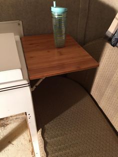 a small table with a cup on it