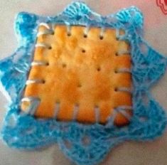 a cookie is sitting on top of a doily